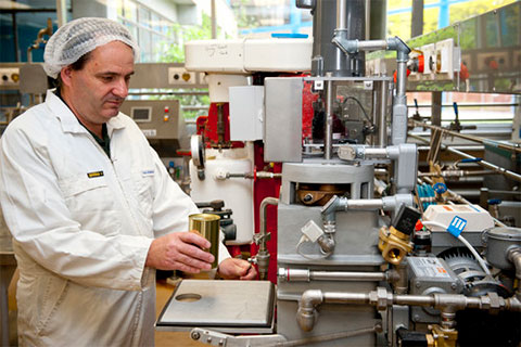 Technician working on equipment in the Food Pilot Plant